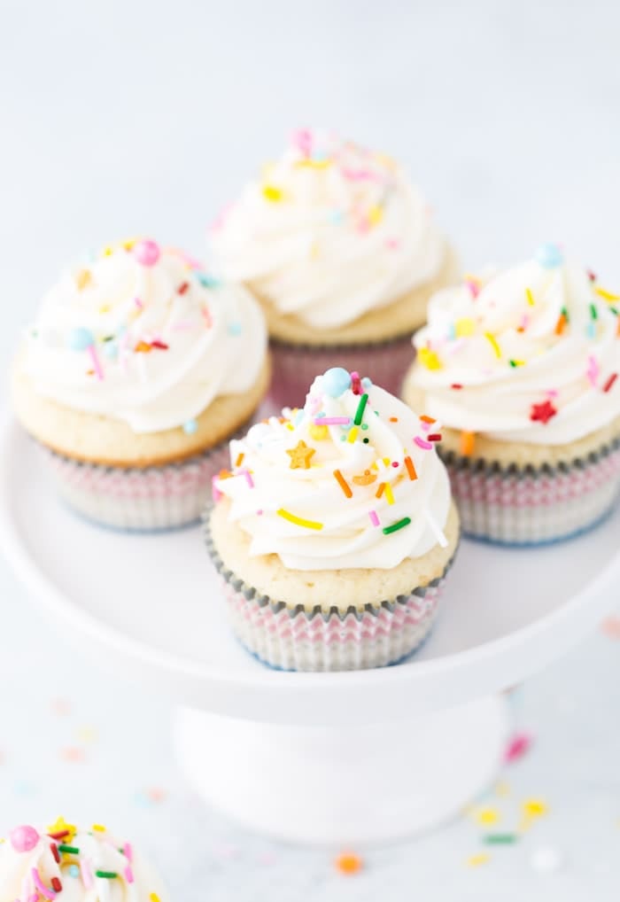 These vanilla cupcakes with cream cheese frosting are moist, light and crumbly.