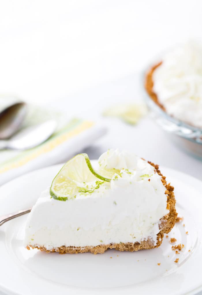 This no bake frozen margarita pie recipe is sweet, tangy and refreshing. Creamy cream cheese and tart lime juice in the perfect summer pie. 