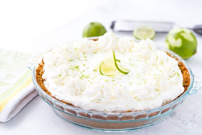 This no bake frozen margarita pie recipe is sweet, tangy and refreshing. Creamy cream cheese and tart lime juice in the perfect summer pie. 