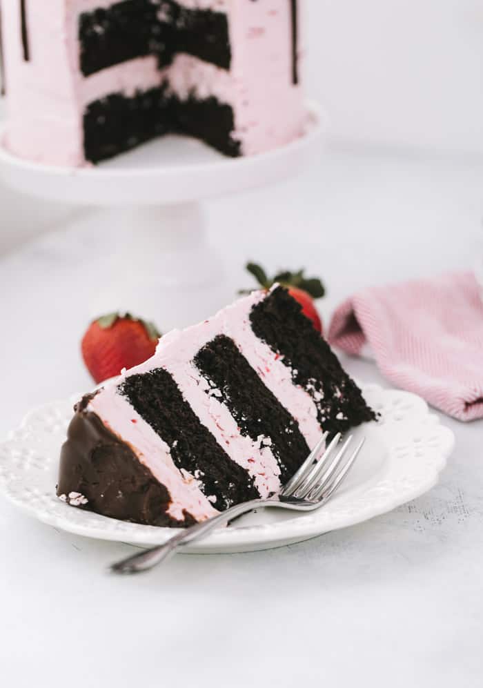 This dark chocolate strawberry cake is a great summer celebration cake for the chocolate and strawberry lovers alike. A decadent dark chocolate cake is filled with a light and fluffy fresh strawberry buttercream.