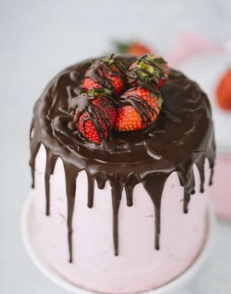 This dark chocolate strawberry cake is a great summer celebration cake for the chocolate and strawberry lovers alike. A decadent dark chocolate cake is filled with a light and fluffy fresh strawberry buttercream.