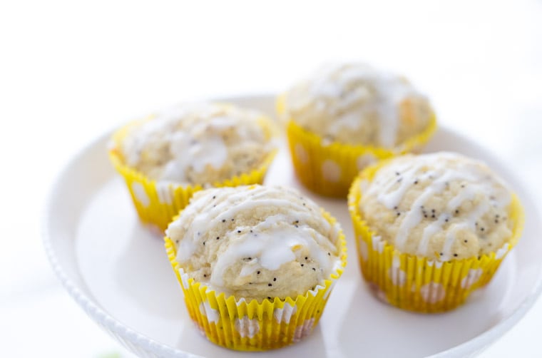 Lemon poppy seed muffins are moist and packed with fresh lemon zest and juice. These lemon poppy seed muffins are what every breakfast should be made of! | Recipe on BlahnikBaker.com