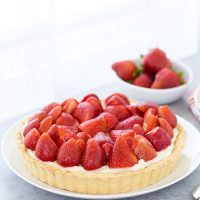 This strawberry mascarpone tart is a beautiful 3-layered tart with a buttery crust and a creamy lemon mascarpone filling topped with fresh strawberries.