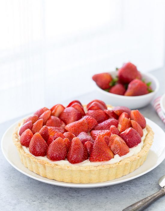 This strawberry mascarpone tart is a beautiful 3-layered tart with a buttery crust and a creamy lemon mascarpone filling topped with fresh strawberries.