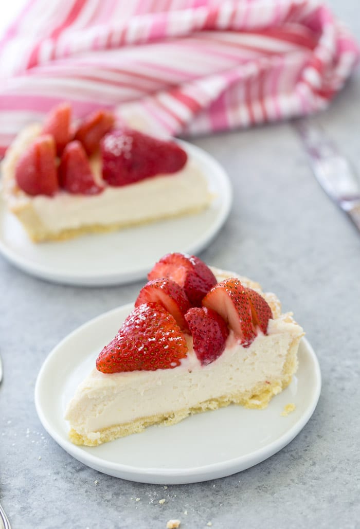 This strawberry mascarpone tart is a beautiful 3-layered tart with a buttery crust and a creamy lemon mascarpone filling topped with fresh strawberries.