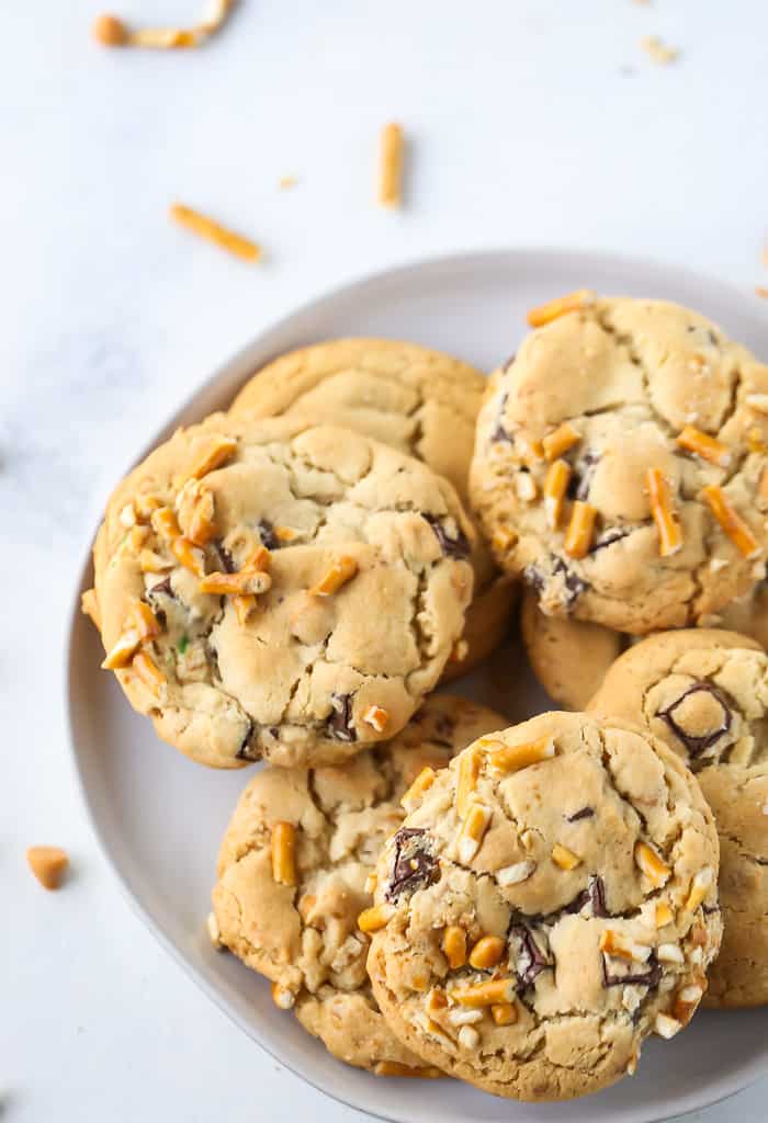 Butterscotch Pretzel Chocolate Chip Cookies on a white plate.