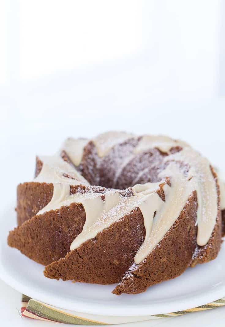 This applesauce cake with caramel glaze recipe is a moist, fluffy, light spiced cake that is topped with a sweet caramel glaze. 