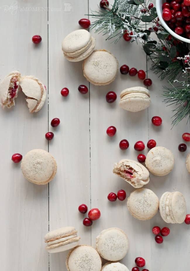 These orange walnut macarons are fun and seasonal and are filled with a subtly Spiced Cinnamon Cream Cheese Frosting and Fresh Cranberry Compote.