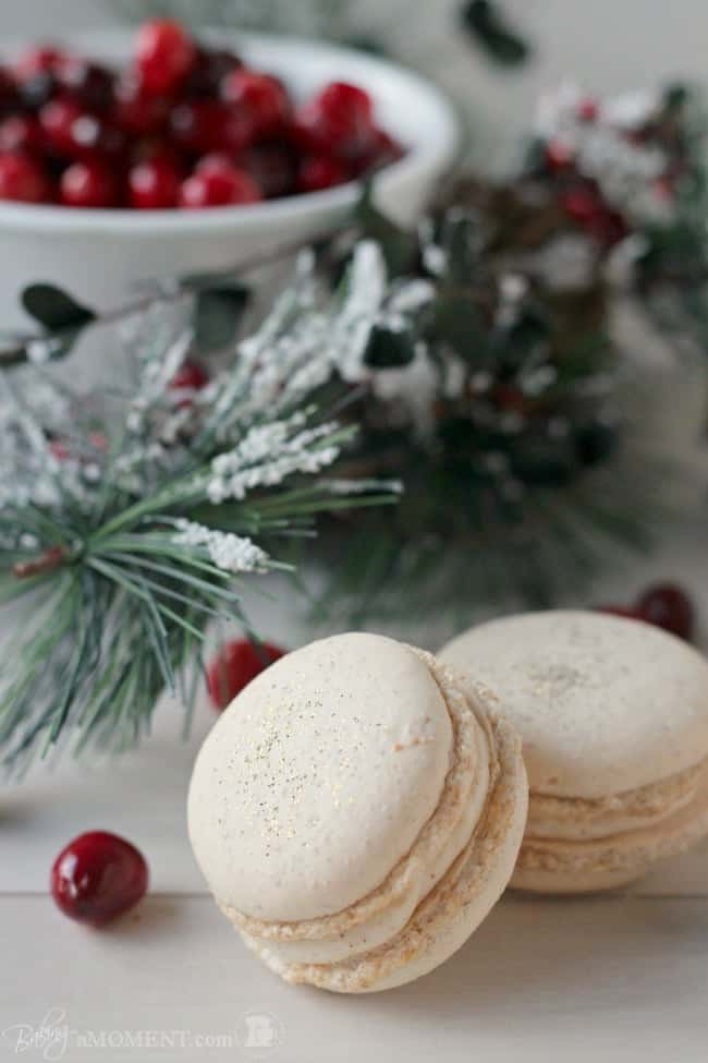 These orange walnut macarons are fun and seasonal and are filled with a subtly Spiced Cinnamon Cream Cheese Frosting and Fresh Cranberry Compote.