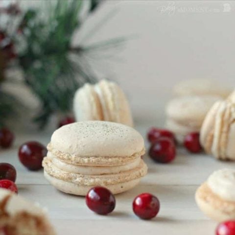 These orange walnut macarons are fun and seasonal and are filled with a subtly Spiced Cinnamon Cream Cheese Frosting and Fresh Cranberry Compote.