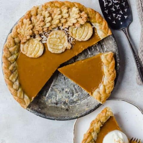 Creamy and delicious pumpkin coconut pie is topped with toasted coconut flakes. You will want this on your Thanksgiving table!