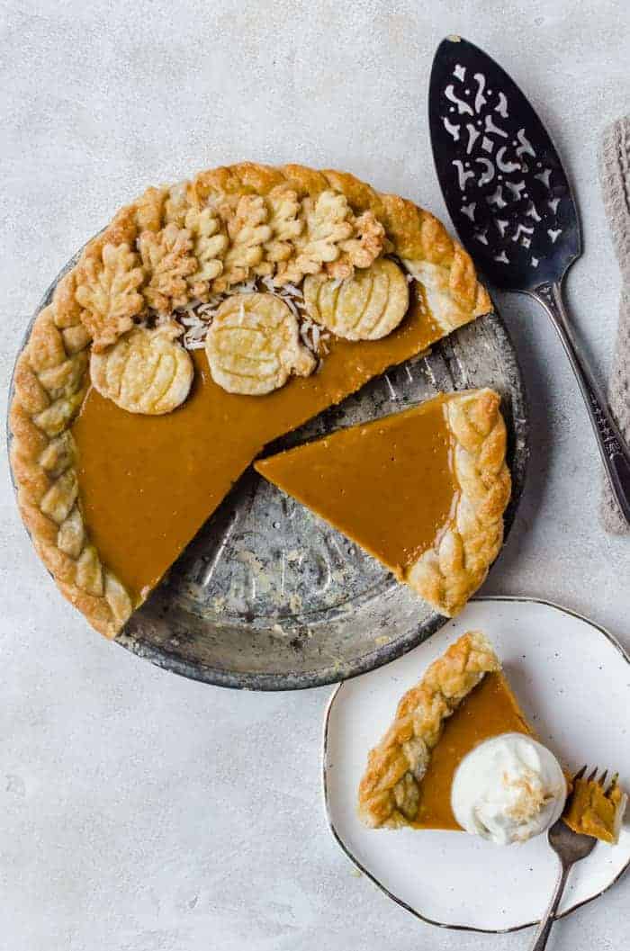 Creamy and delicious pumpkin coconut pie is topped with toasted coconut flakes. You will want this on your Thanksgiving table!