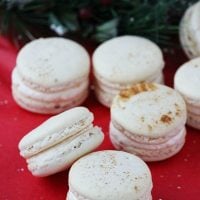 Eggnog macarons are perfectly spiced holiday cookies, with hints of cinnamon, cloves and nutmeg, filled with creamy eggnog buttercream. | Recipe on BlahnikBaker.com