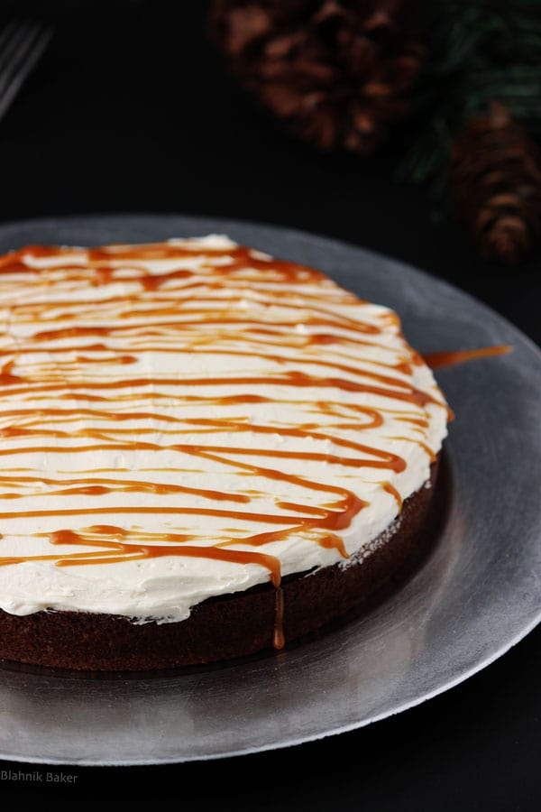 Gingerbread Cake with Molasses Buttercream Frosting - Gingerbread cake, moist and flavorful, with molasses buttercream and salted caramel drizzle. A holiday dessert that will surely become a new favorite! | Recipe on BlahnikBaker.com