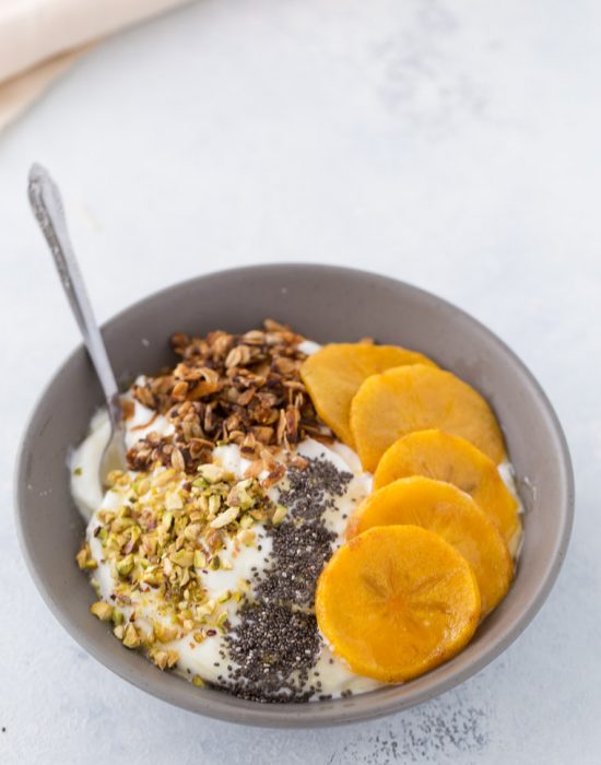 This roasted persimmon yogurt bowl is a quick and easy breakfast bowl full of winter flavors.