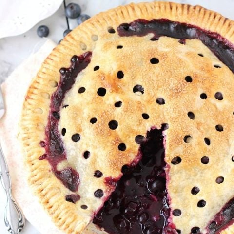 A classic blueberry pie recipe with a buttery flaky crust, fresh blueberries and fresh lemon juice. This recipe is summer perfect!