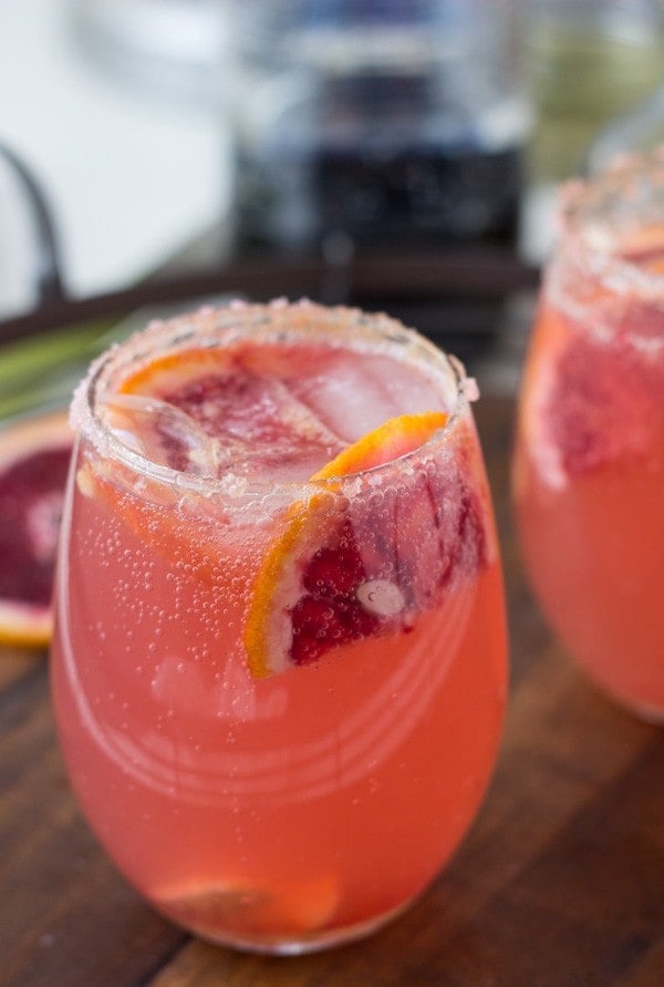 Recipes for two sparkling grapefruit cocktails to get you started on your parties; a grapefruit rosemary sparkler and a grapefruit ginger-orange cocktail!