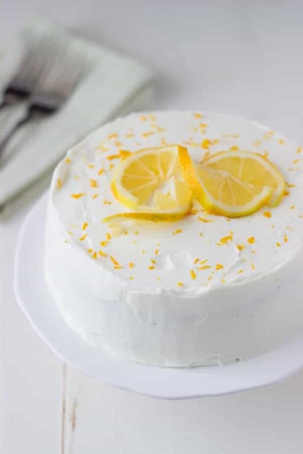 Meyer Lemon Cake with White Chocolate Mousse - a small scale soft lemon cake topped with whipped white chocolate mousse