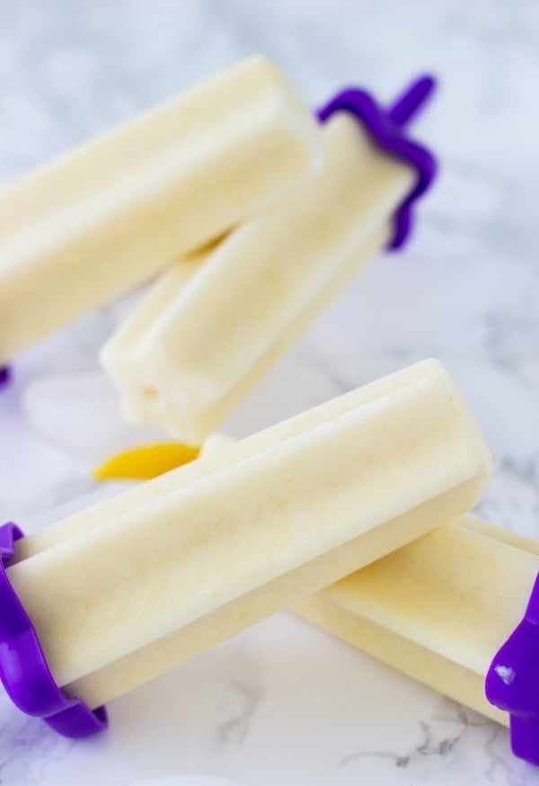 These mango yogurt popsicles are refreshing, a little healthier with greek yogurt and coconut milk. 