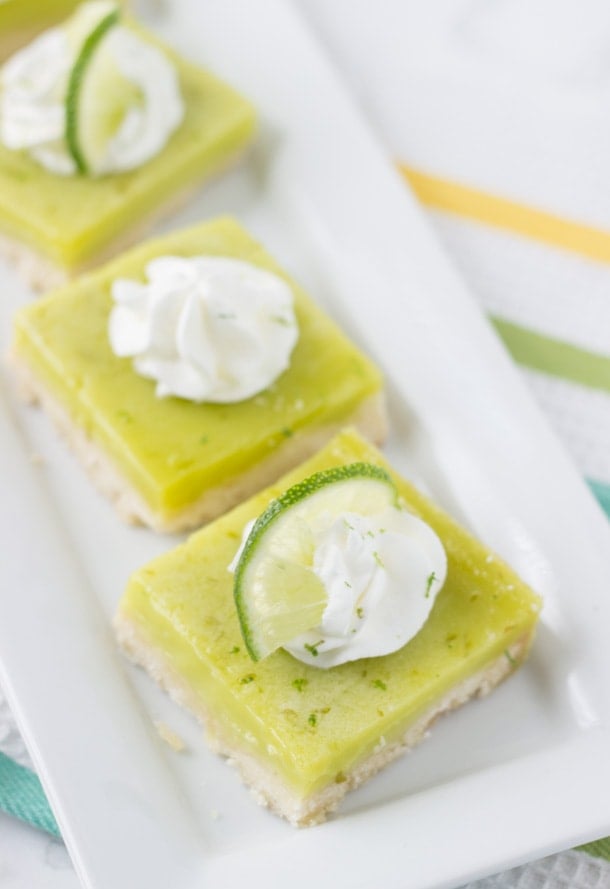 Coconut Lime Bars- sweet and tart bars with hints of tropical coconut in the shortbread crust!