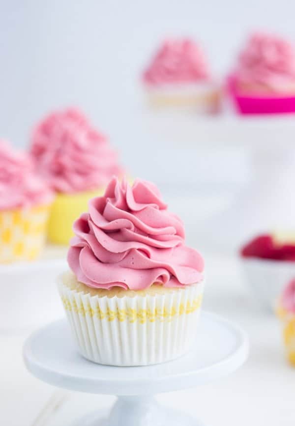 Raspberry Lemon Cupcakes - fresh lemon cupcakes filled with raspberry lemon curd and topped with a fluffy raspberry frosting.