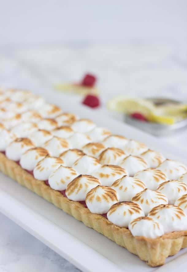 Raspberry Lemon Meringue Tart - A buttery pastry crust filled with sweet and tart raspberry lemon curd and topped with a fluffy toasted meringue.