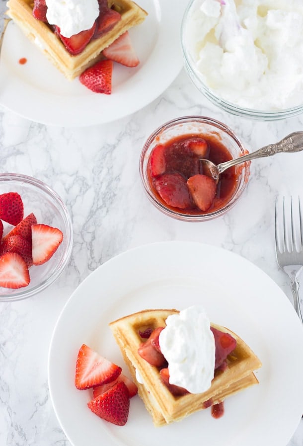 Easy Coconut Waffles recipe made with a buttermilk pancake mix and topped with strawberry rhubarb compote.