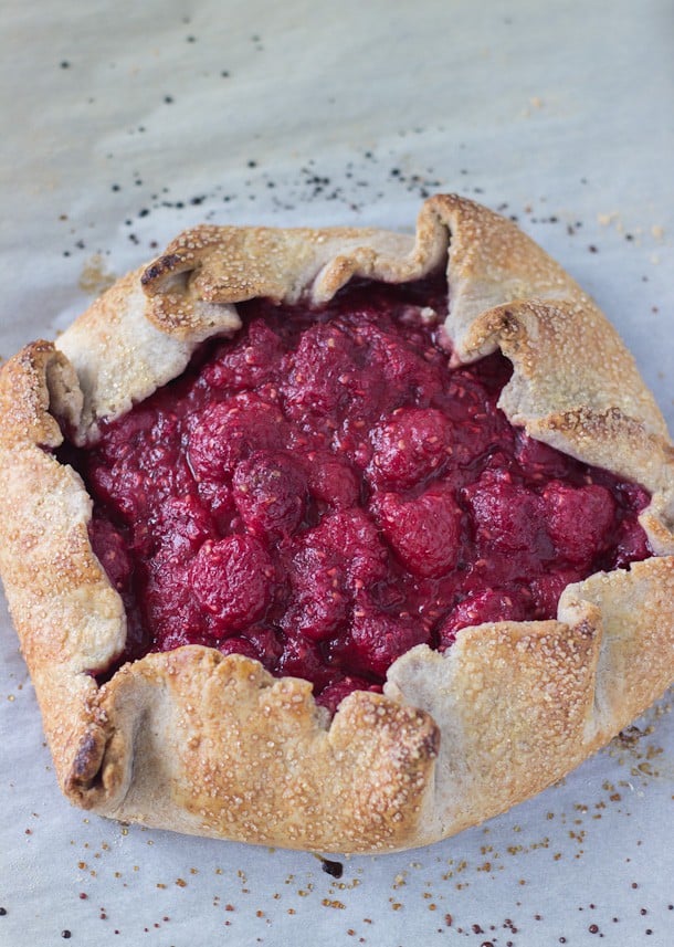 This Raspberry Vanilla Bean Galette recipe is sweet and full of juicy raspberries and bursting with vanilla bean flavors. It's the perfect summer lazy pie.