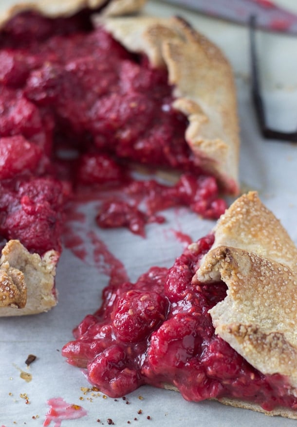 This Raspberry Vanilla Bean Galette recipe is sweet and full of juicy raspberries and bursting with vanilla bean flavors. It's the perfect summer lazy pie.