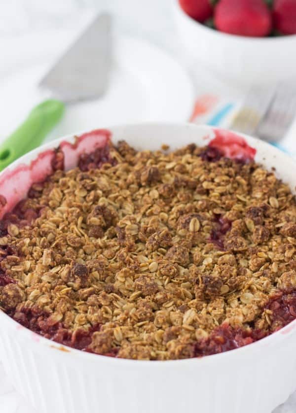 This strawberry raspberry rhubarb crumble is bursting with sweet and tart juices on the inside and topped with a gluten-free coconut oatmeal crumb topping. 