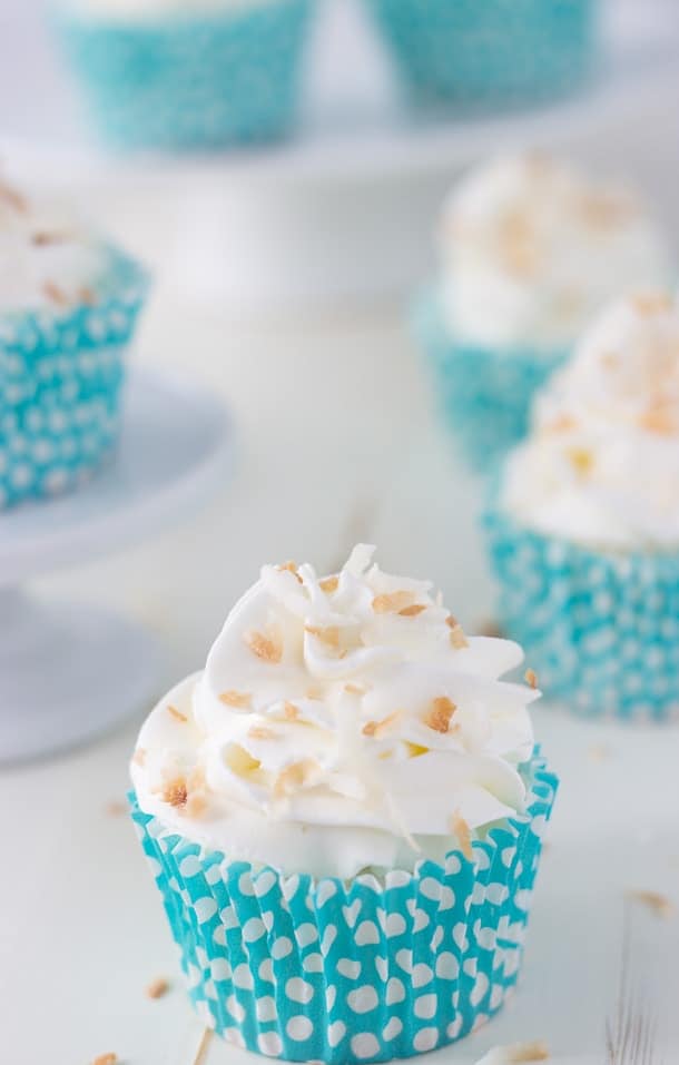 Light and airy coconut angel food cupcakes are topped with a coconut whipped cream frosting to make these delightful cupcakes!! 