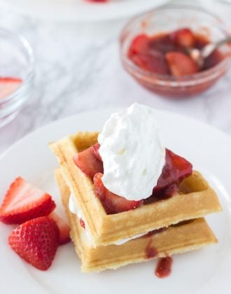 This Easy Coconut Waffles recipe made with a buttermilk pancake mix and topped with strawberry rhubarb compote. Perfect for brunch.