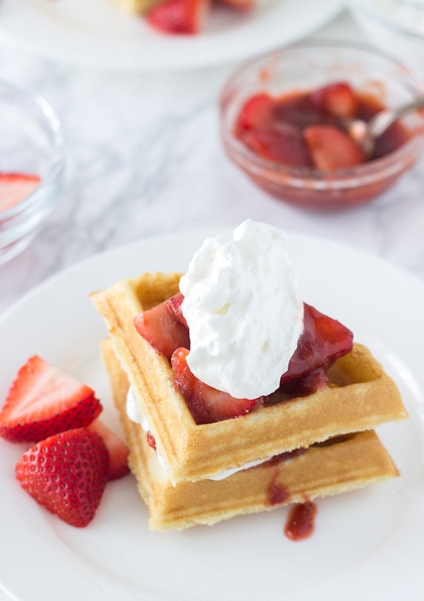 This Easy Coconut Waffles recipe made with a buttermilk pancake mix and topped with strawberry rhubarb compote. Perfect for brunch. 