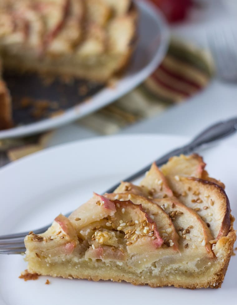 A sweet tart dough, nutty frangipane filling and toasted sesame seeds makes this apple tart recipe a winner.