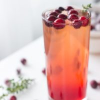 Refreshing Cranberry Thyme Sparklers made bubbly with 7UP or Ginger Ale make for a simple and easy holiday cocktail.