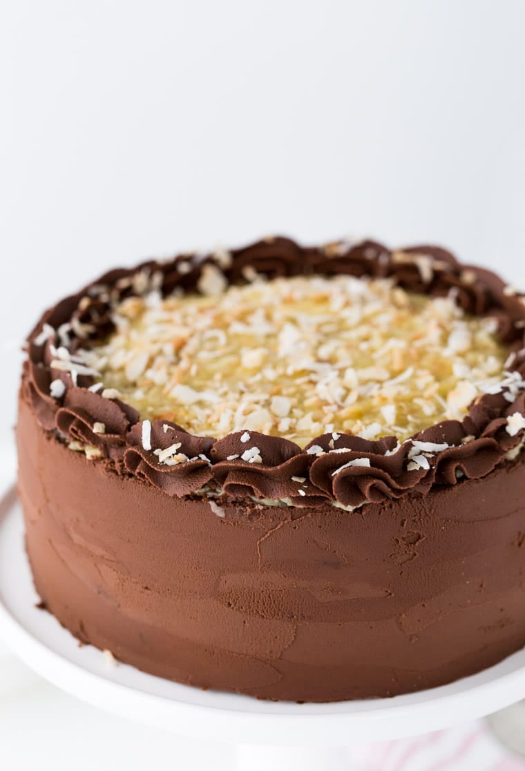 This classic German Chocolate Cake is a rich chocolate cake, filled with a coconut pecan filling and finished off with a decadent chocolate frosting.
