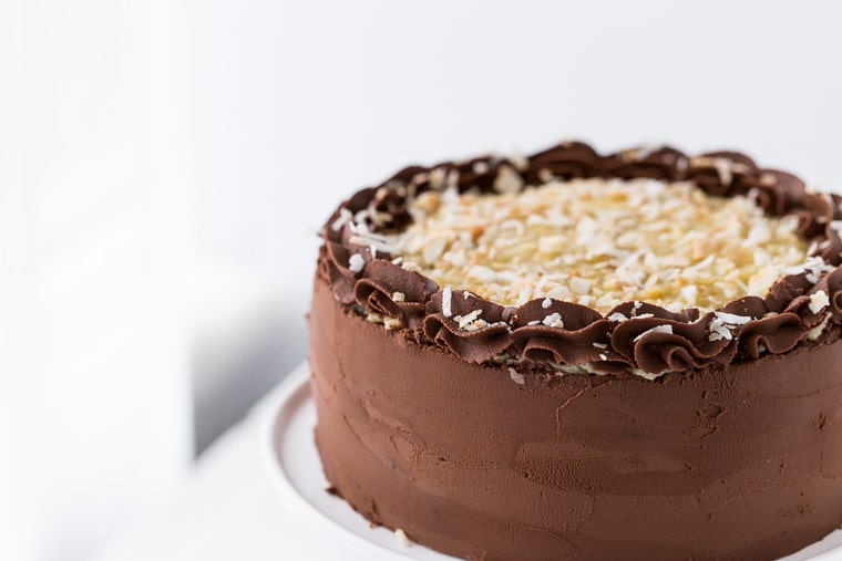 This classic German Chocolate Cake is a rich chocolate cake, filled with a coconut pecan filling and finished off with a decadent chocolate frosting.