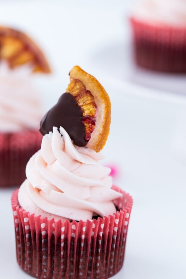 A classic chocolate cupcake recipe with sweet orange zest and blood orange buttercream. These Blood Orange Chocolate Cupcakes are a wonder!