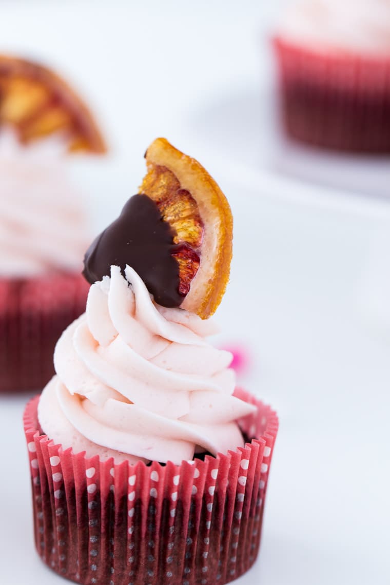 A classic chocolate cupcake recipe with sweet orange zest and blood orange buttercream. These Blood Orange Chocolate Cupcakes are a wonder! 