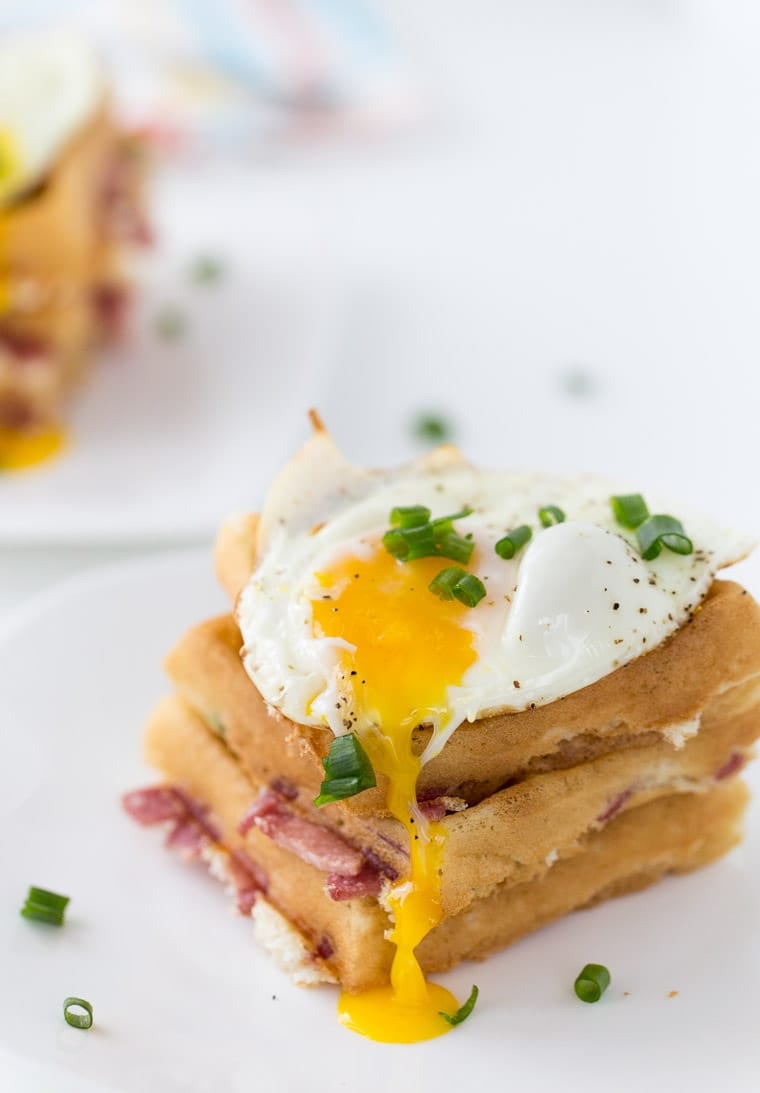 These cheddar and bacon waffles are perfect recipe for breakfast nights and brunch. With soft buttermilk waffles filled with cheddar cheese, bacon and topped with an egg. 