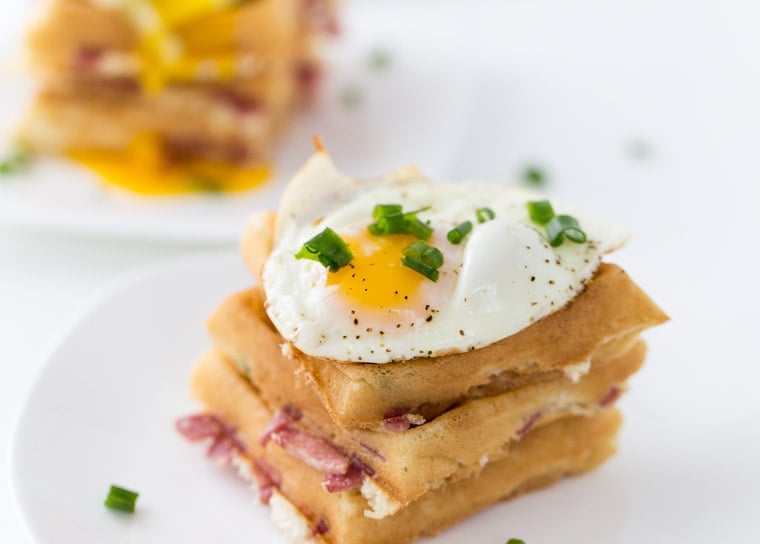 These cheddar and bacon waffles are perfect recipe for breakfast nights and brunch. With soft buttermilk waffles filled with cheddar cheese, bacon and topped with an egg. 