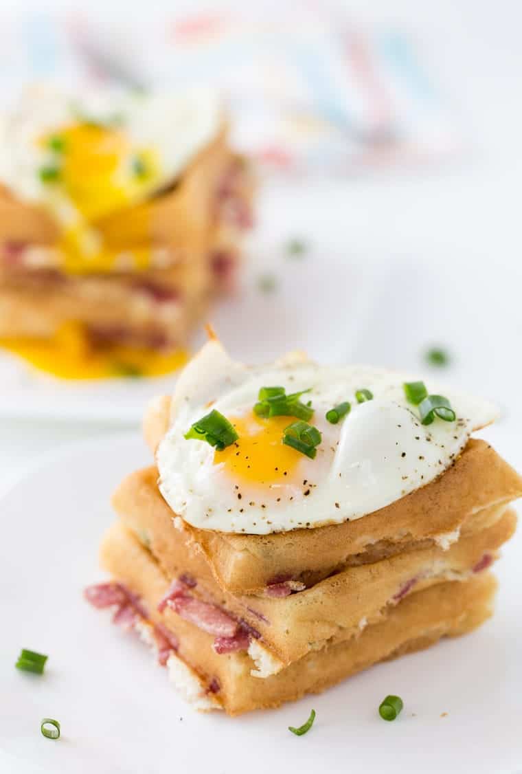 These cheddar and bacon waffles are perfect recipe for breakfast nights and brunch. With soft buttermilk waffles filled with cheddar cheese, bacon and topped with an egg. 