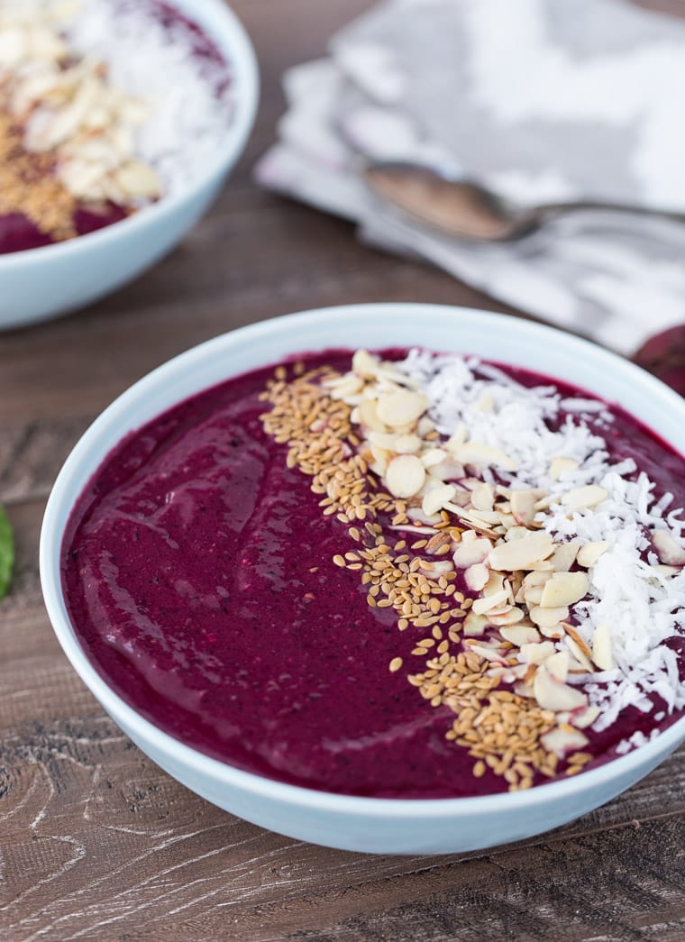 A healthy recipe to drink or slurp your fruits and veggies in this berry beets smoothie bowl with chia seeds, lime juice, honey and mint. 