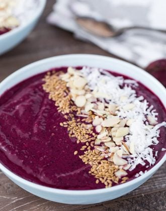 A healthy berry beet smoothie bowl with mint, chia seeds and coconut.