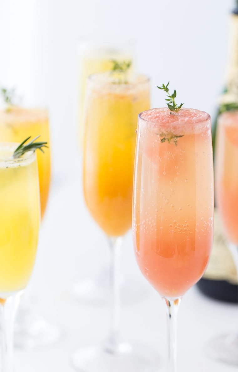 A refreshing winter mimosa, this Grapefruit Mimosa recipe is perfect for any weekend brunch with freshly squeezed grapefruit juice and fresh herbs. 