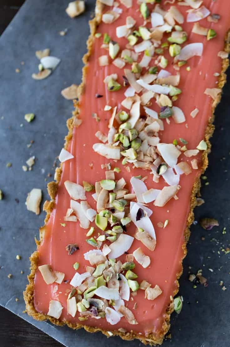This grapefruit tart recipe starts with a crunchy graham cracker crust with toasted coconut and is filled with a sweet, tangy grapefruit curd. 