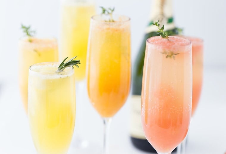 A refreshing winter mimosa, this Grapefruit Mimosa recipe is perfect for any weekend brunch with freshly squeezed grapefruit juice and fresh herbs. 