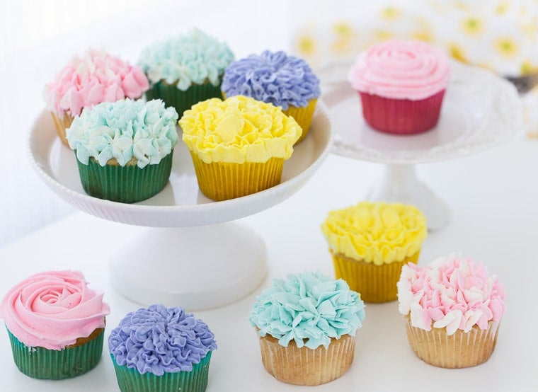 A tutorial on how to make flower cupcakes using vanilla buttercream and piping bags. These cupcakes are perfect for Spring and Mother's Day!