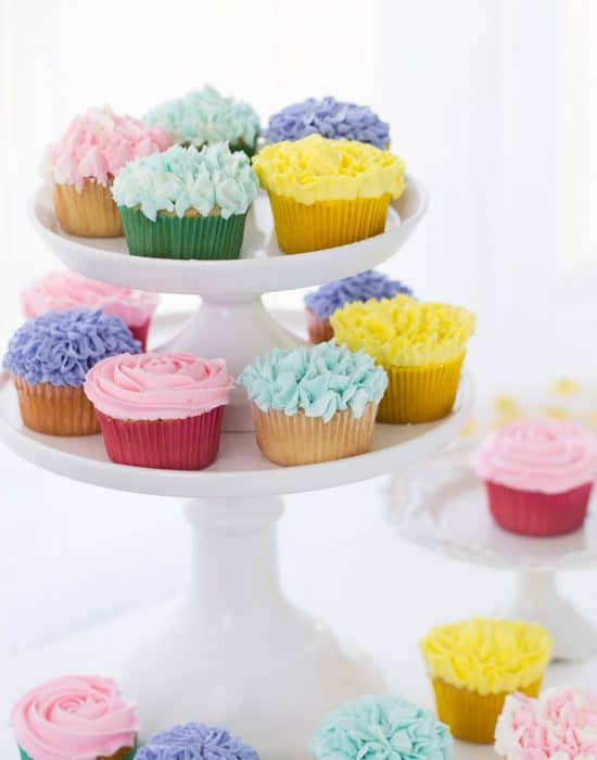 A tutorial on how to make flower cupcakes using vanilla buttercream and piping bags. These cupcakes are perfect for Spring and Mother's Day!