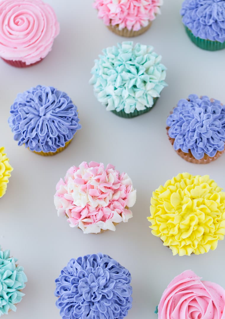 A tutorial on how to make flower cupcakes using vanilla buttercream and piping bags. These cupcakes are perfect for Spring and Mother's Day!